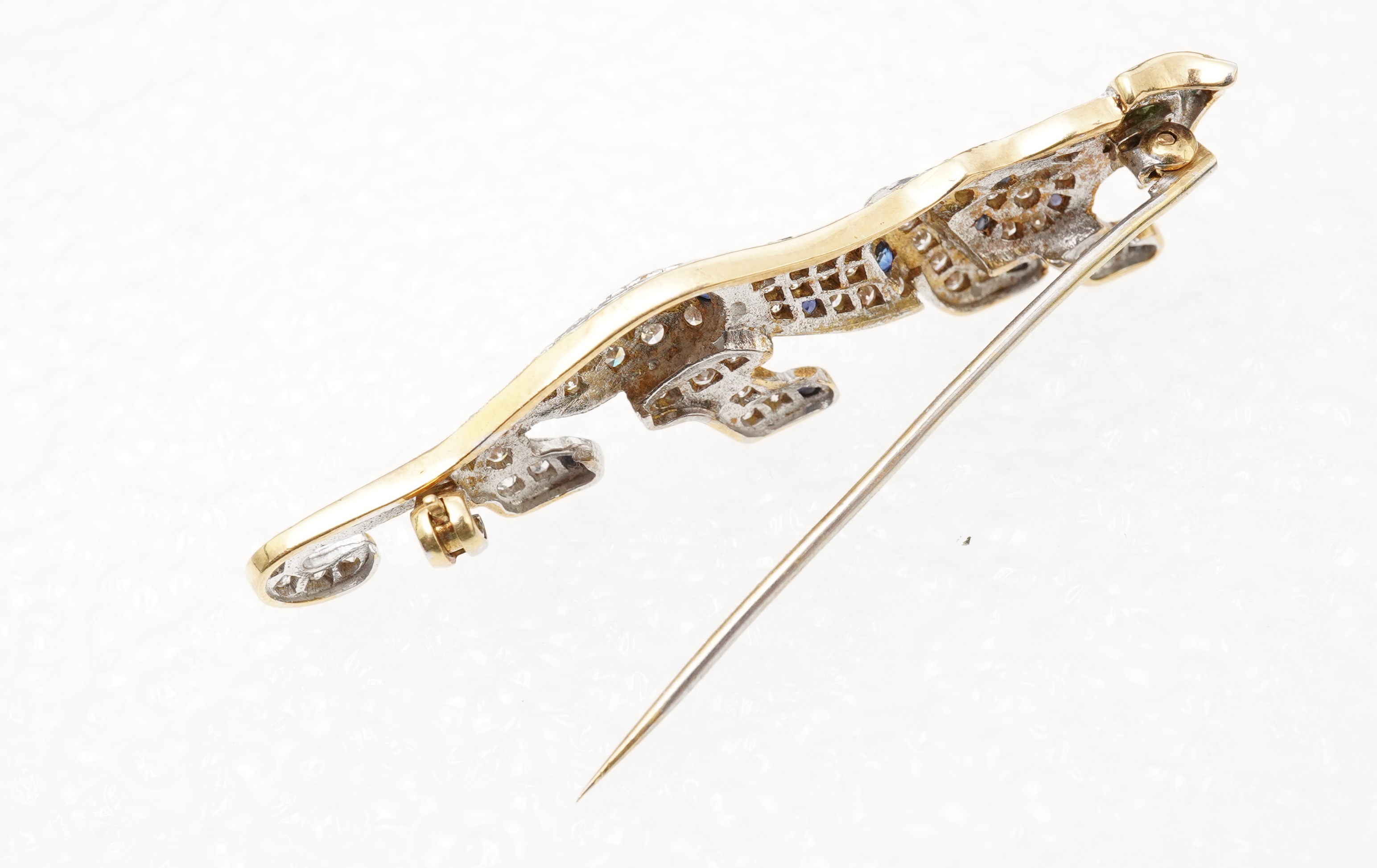 A sapphire, emerald and diamond brooch, circa 1988